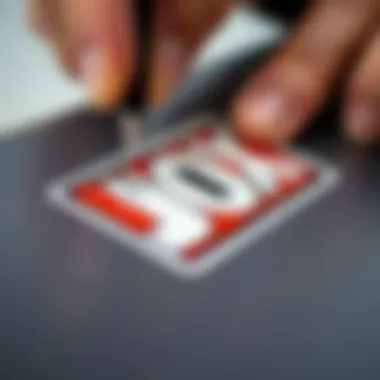 Detailed Application of Box Logo Sticker A close-up of a box logo sticker being applied to a surface, highlighting the intricacies of the design.