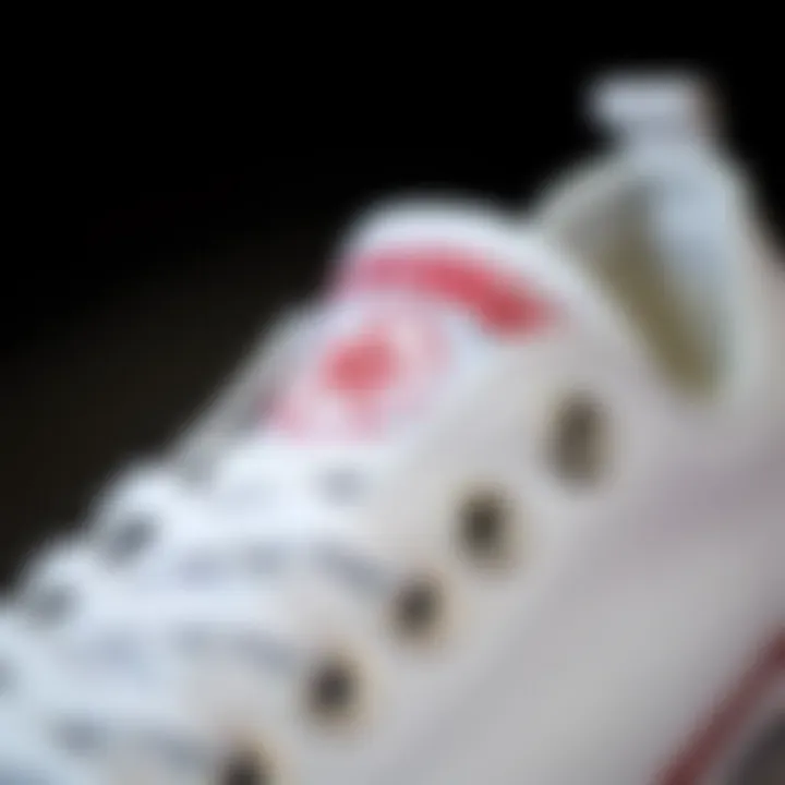Close-up of the iconic Converse logo on a white sneaker.