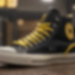 Close-up view of the black and yellow Chuck Taylor sneaker showcasing its unique design elements.