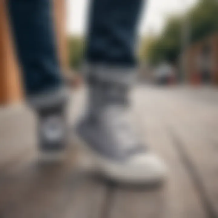 Stylish Converse All Star Gray sneakers displayed on a skateboarding deck