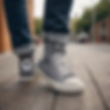 Stylish Converse All Star Gray Sneakers Stylish Converse All Star Gray sneakers displayed on a skateboarding deck