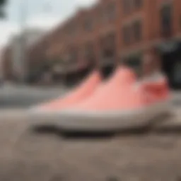 Stylish Coral Slip-On Vans against a vibrant urban backdrop