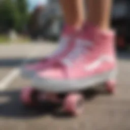 Stylish pink high top Vans on a skateboard