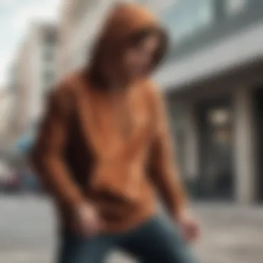 A skateboarder in action wearing a corduroy hoodie