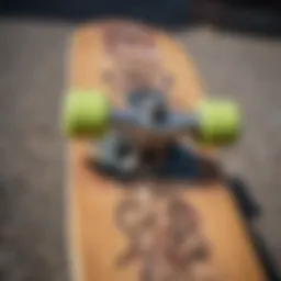 Close-up of a used skateboard showcasing unique graphics and wear