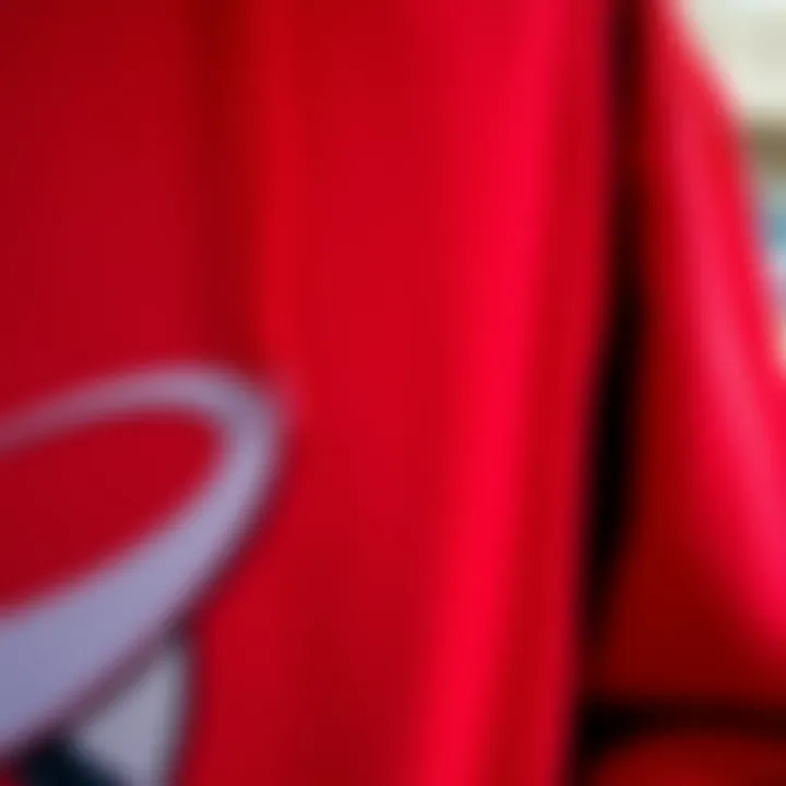 Close-Up of Red Hoodie Fabric Close-up of red hoodie fabric reflecting street art background