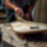 Sanding the Skateboard Deck for Restoration Skateboard deck being sanded for restoration