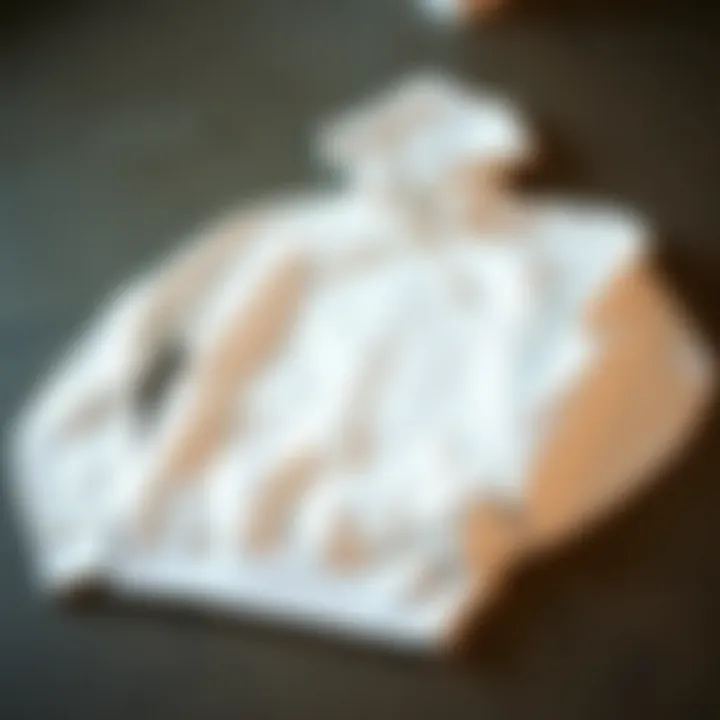 Caring for Your All White Hoodie Maintenance tips for caring an all white hoodie laid out on a surface