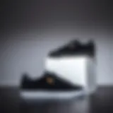 Stylish black on black Puma suede sneakers displayed against a minimalist background