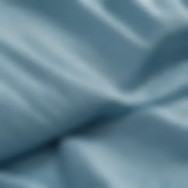 Close-up of the fabric texture and features of a light blue windbreaker