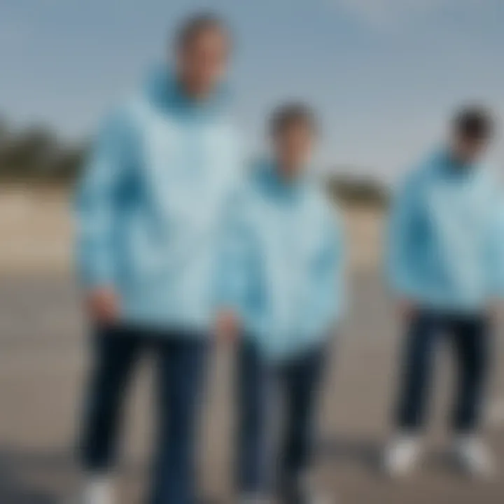 A group of skateboarders showcasing different styles of light blue windbreakers