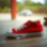 Red Converse Shoes: A Fashion Statement A stylish pair of red Converse shoes on a wooden surface