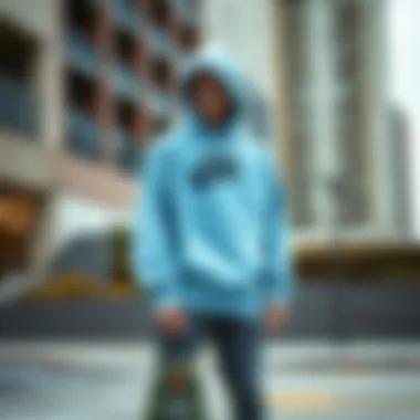 Skateboarder wearing light blue Nike sweatshirt in urban setting Skateboarder wearing light blue Nike sweatshirt in urban setting