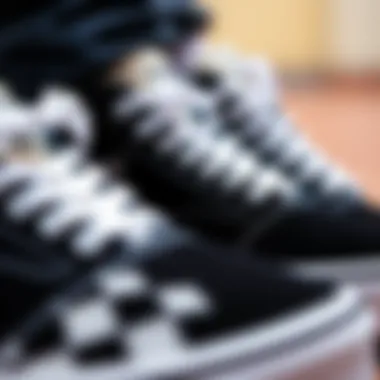 Detailing the Iconic Vans Design A close-up of Vans black and white shoes showcasing design details