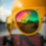 Close-up of yellow shade glasses reflecting a vibrant skateboard park